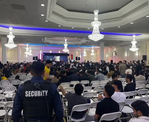 Security guards managing crowd entry at Ontario event venue