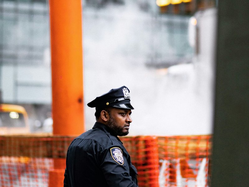 Security guard patrolling outdoor storage yard in Ontario